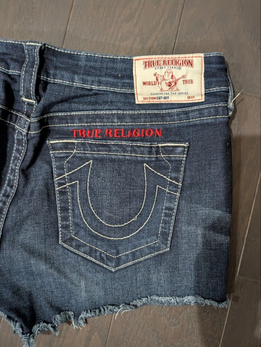 True Religion Women’s Dark Indigo Denim Cutoff Shorts with Red Logo Size 33